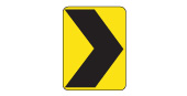 Chevron (arrowhead) signs are posted in groups to guide drivers around sharp curves in the road