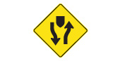 Divided highway begins: traffic travels in both directions on separated roads ahead. Keep to the right-hand road. Each road carries one-way traffic